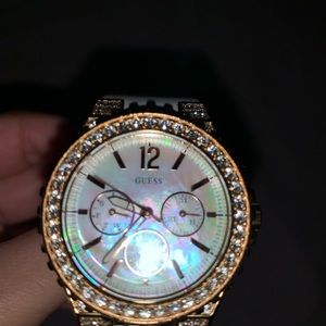 A Guess watch with a mother of pearl face